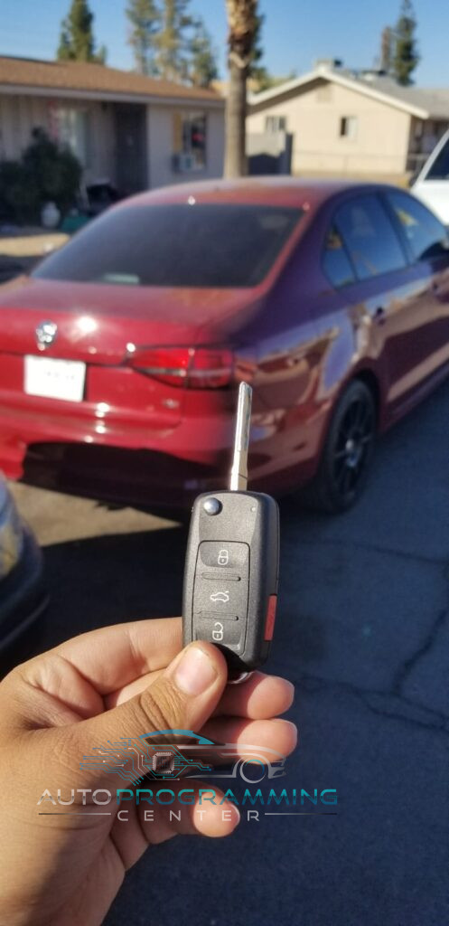 High-resolution image showcasing an automotive locksmith programming a Volkswagen car key for enhanced security and convenience. High-resolution image showcasing an automotive locksmith programming a Volkswagen car key for enhanced security and convenience.