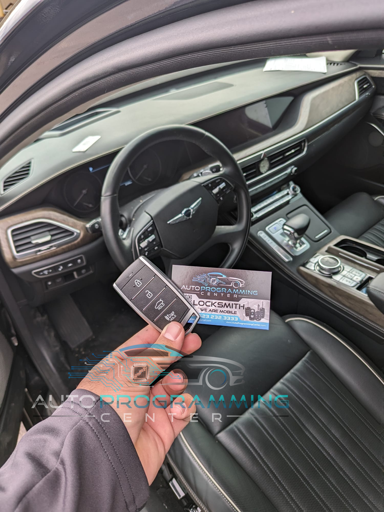 High-resolution image showcasing the sophisticated design and advanced features of a Genesis car key fob for seamless vehicle access and control.